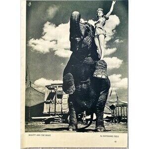 Popular Photography Photo "Beauty & the Beast" Women Standing on Elephant" 1940